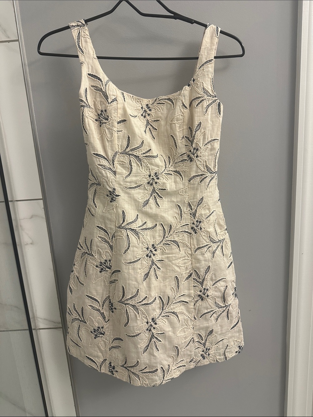 The O Boutique Cream Dress with Blue Floral Embroidery